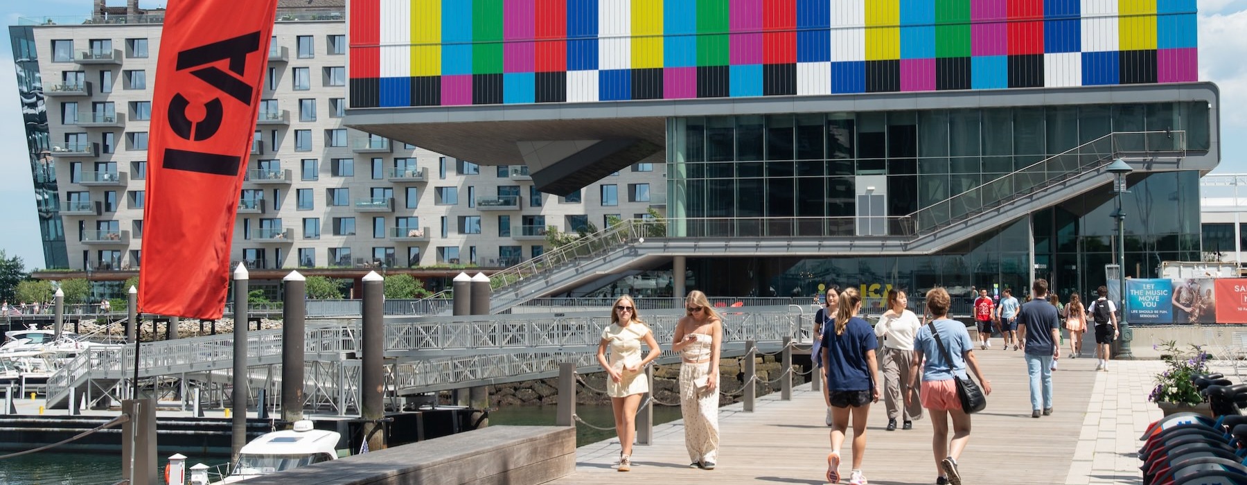 a group of people walking outside of a building