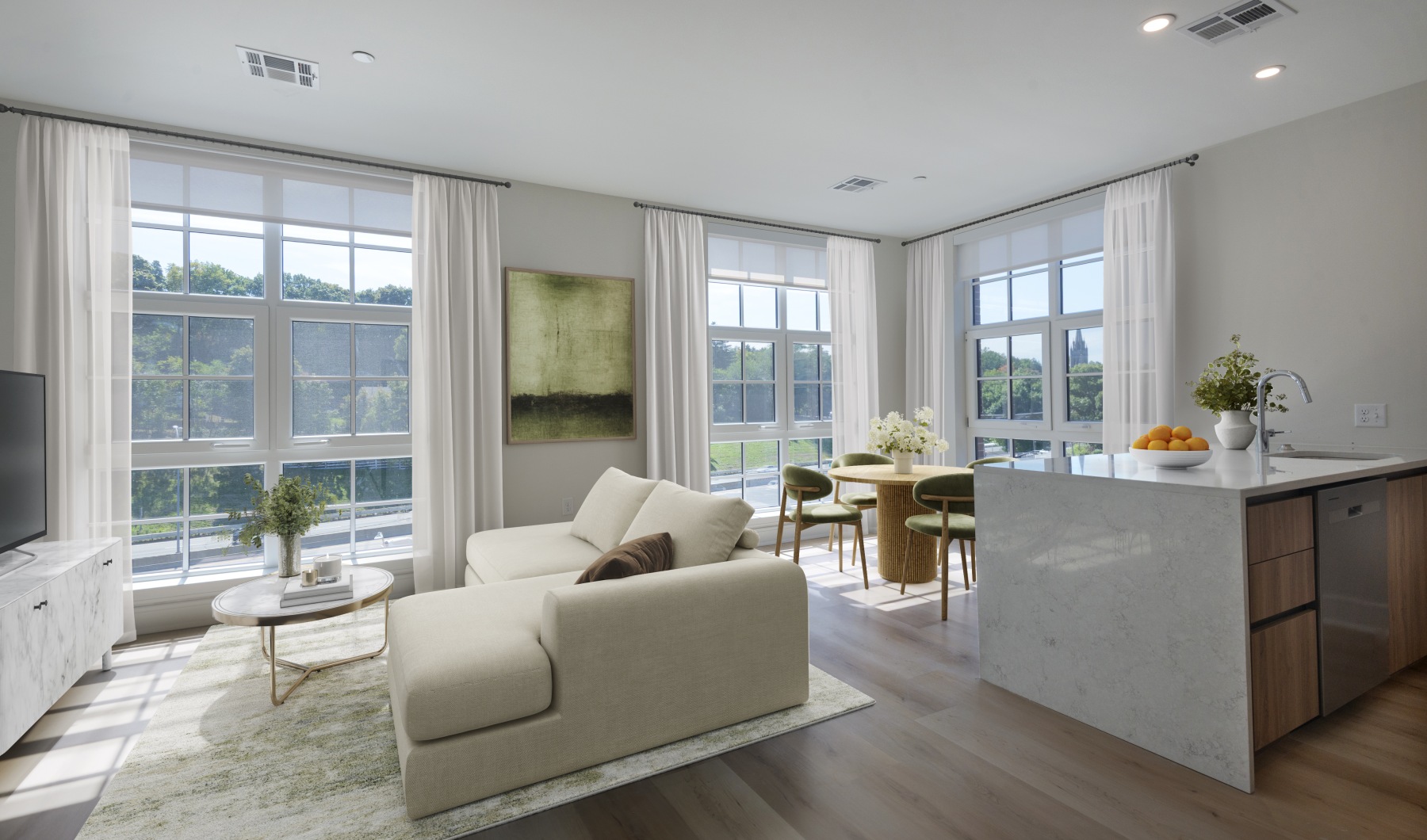 a living room with a white couch and a table